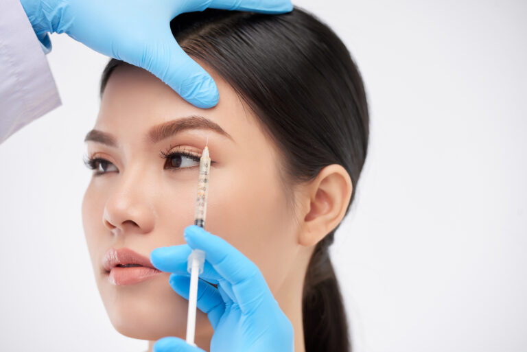 Close-up of botox brow lift injection placed precisely above the eyebrow for subtle lift.