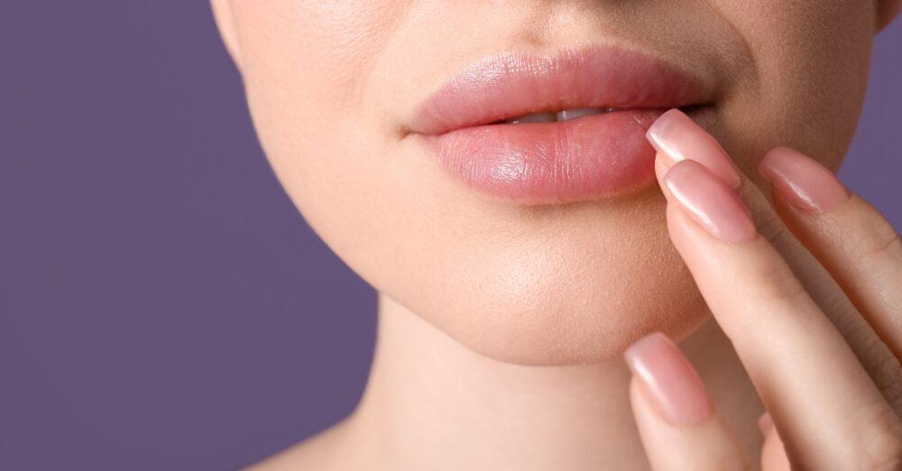 Close-up illustration of a woman touching her lips